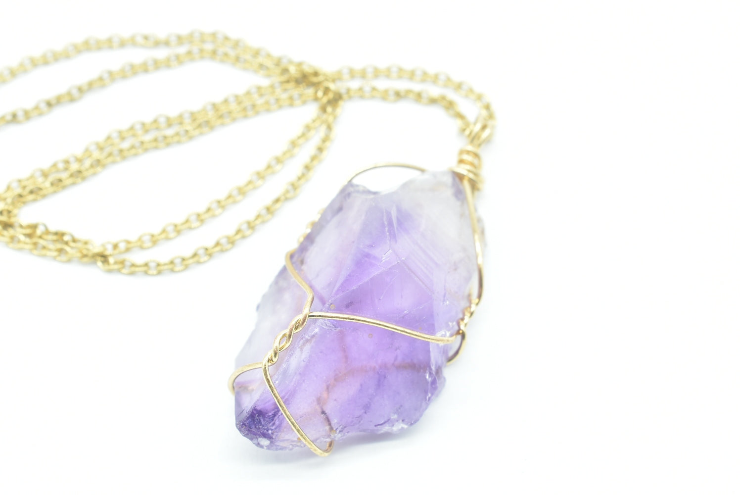 Raw Amethyst Pendant in brass wire