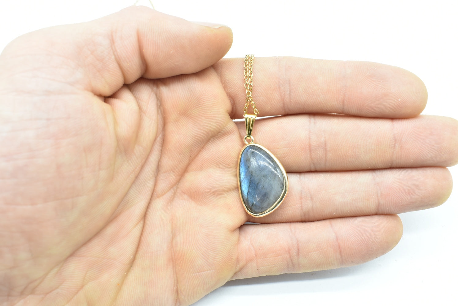 Labradorite teardrop pendant with gold-colored supports