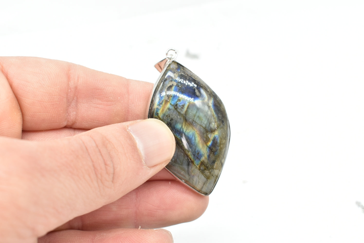 Labradorite leaf pendant with silver colored supports